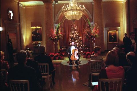 Yo-Yo Ma playing cello in a decorated room in The West Wing: "Noel"