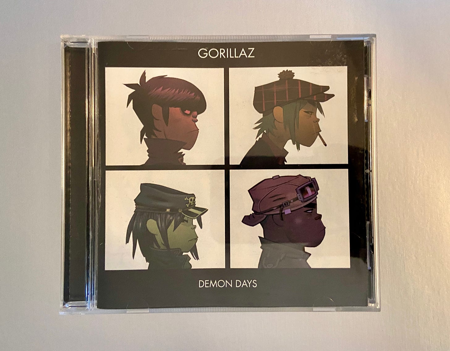 the jewel case for Demon Days by Gorillaz (CD).