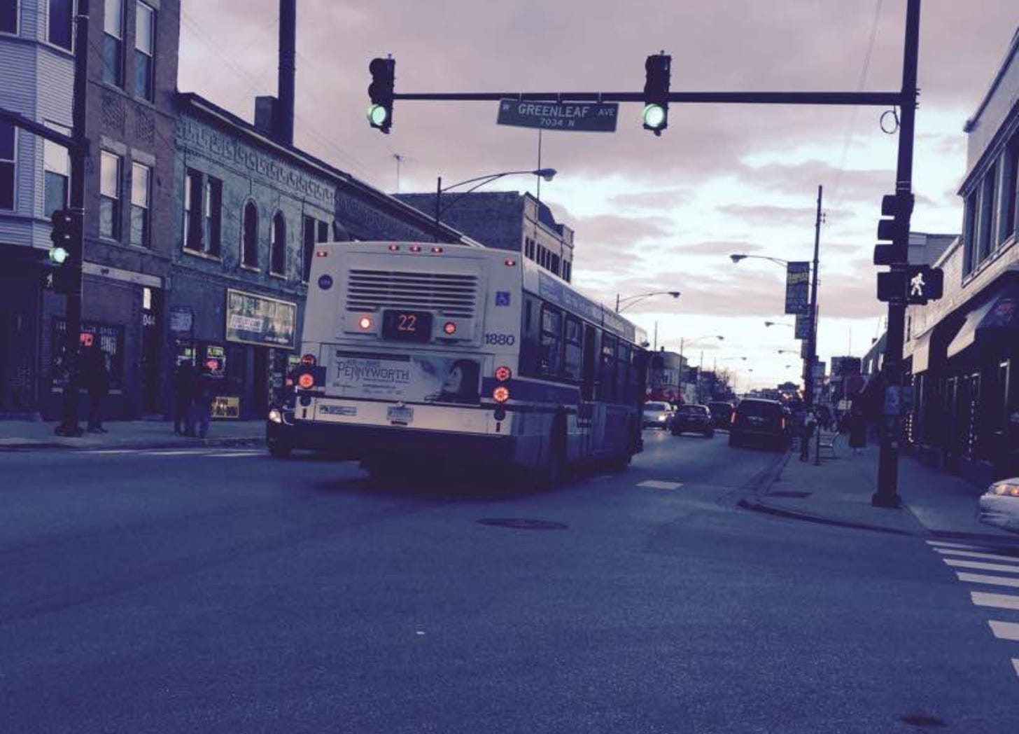 Bus driving down the the street.