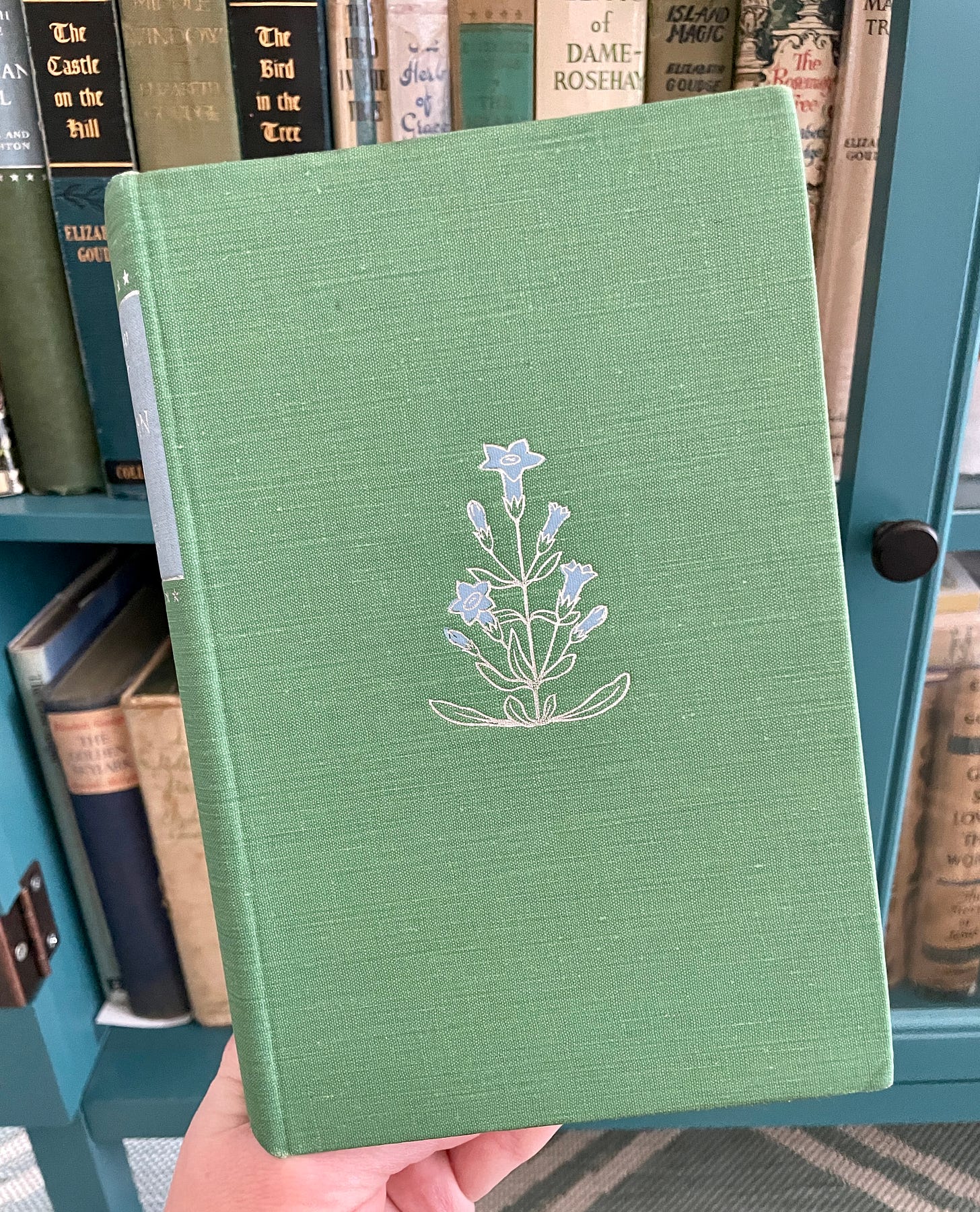 Gentian flowers on the front of my British copy of Gentian Hill by Elizabeth Goudge