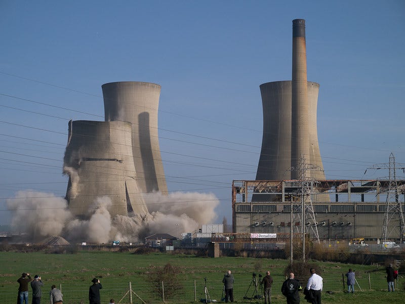 Photo showing the demolition of the cooling tower of a coal fired power station.