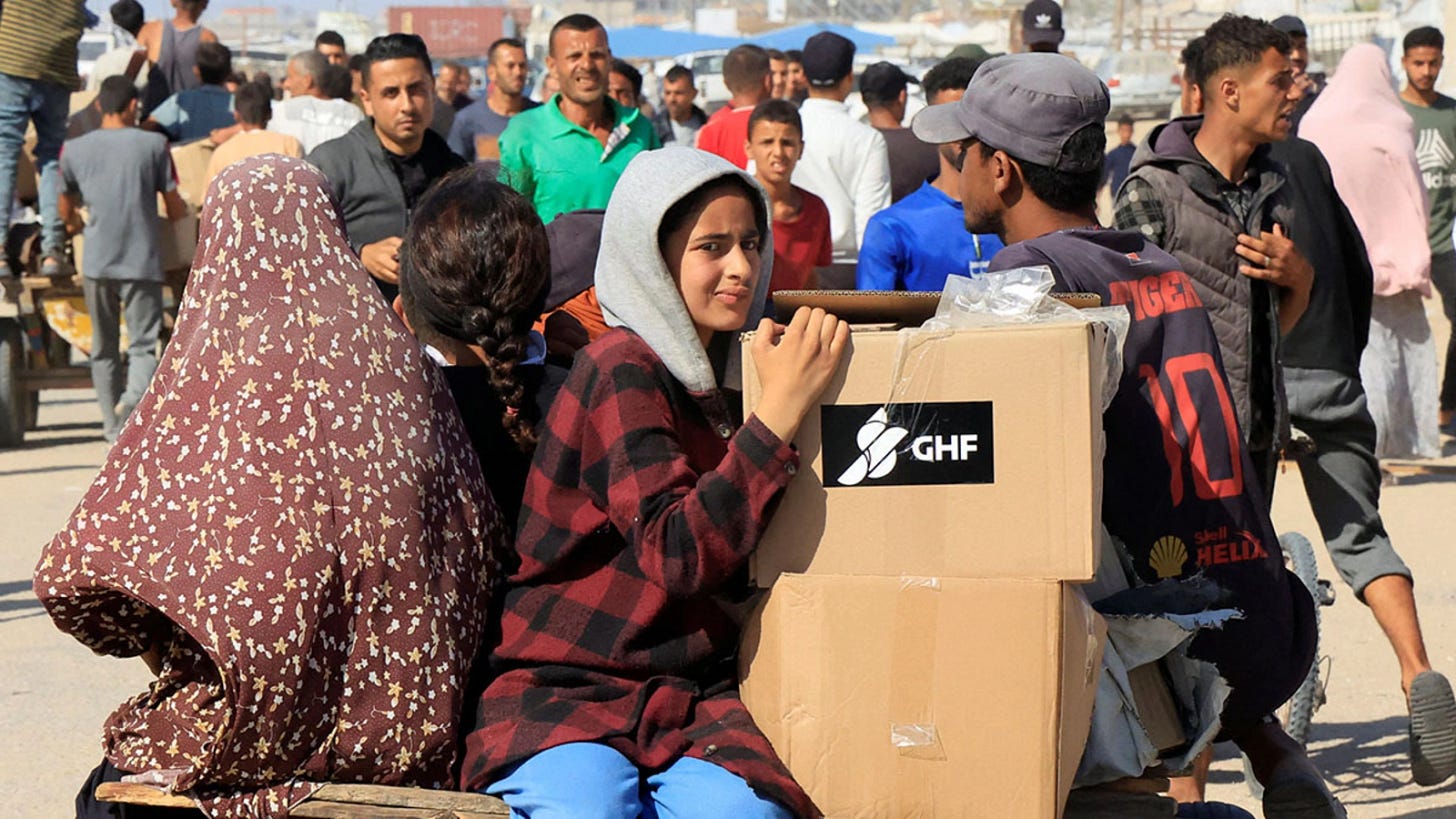 Palestinians seek aid near an aid distribution site run by the Gaza Humanitarian Foundation, in Rafah, in the southern Gaza Strip. Palestinians seek aid near an aid distribution site run by the Gaza Humanitarian Foundation, in Rafah, in the southern Gaza Strip.