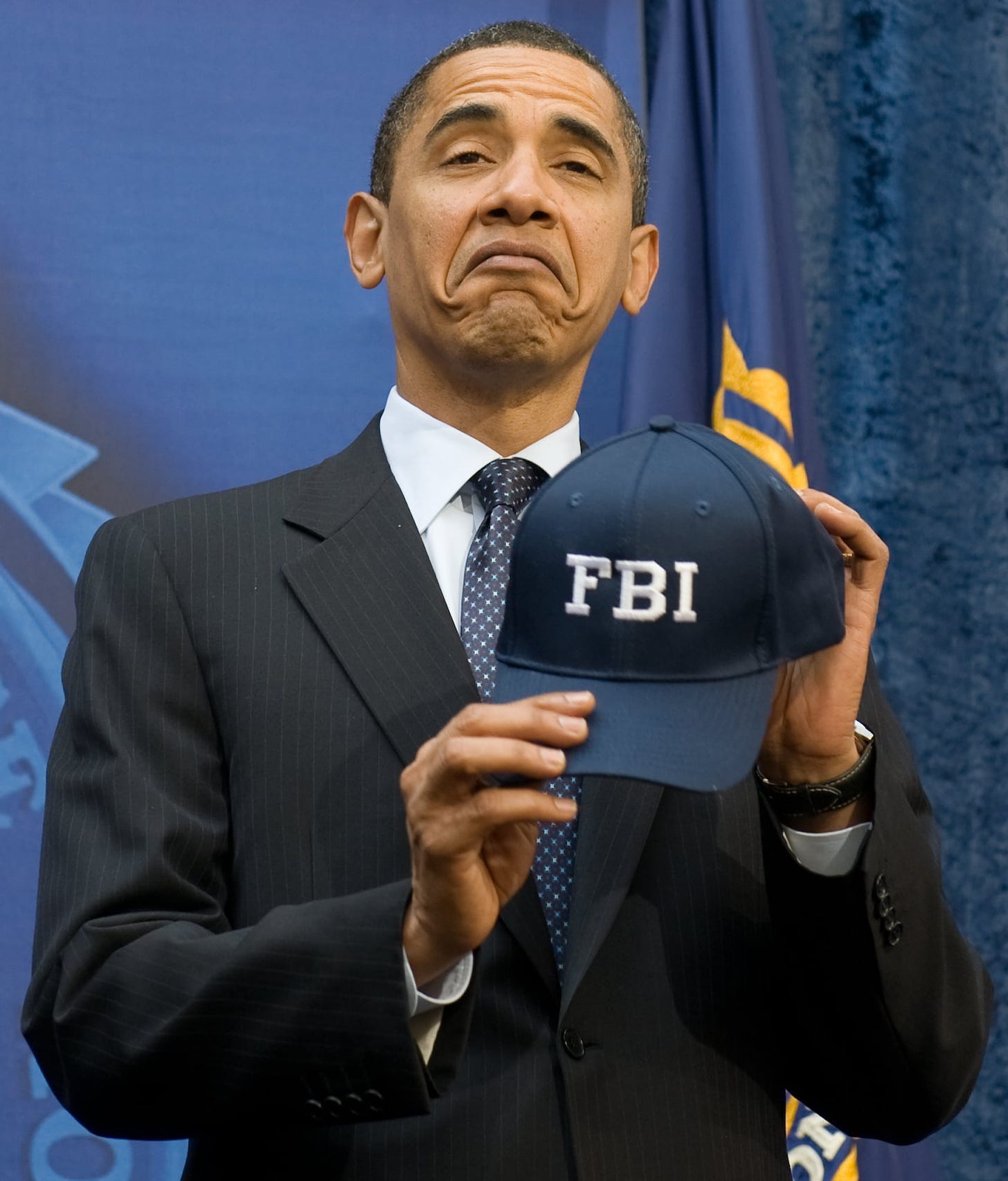 Showing off his FBI hat in 2009. | 56 Underrated Photos of President Obama  During His Time in Office | POPSUGAR News Photo 11