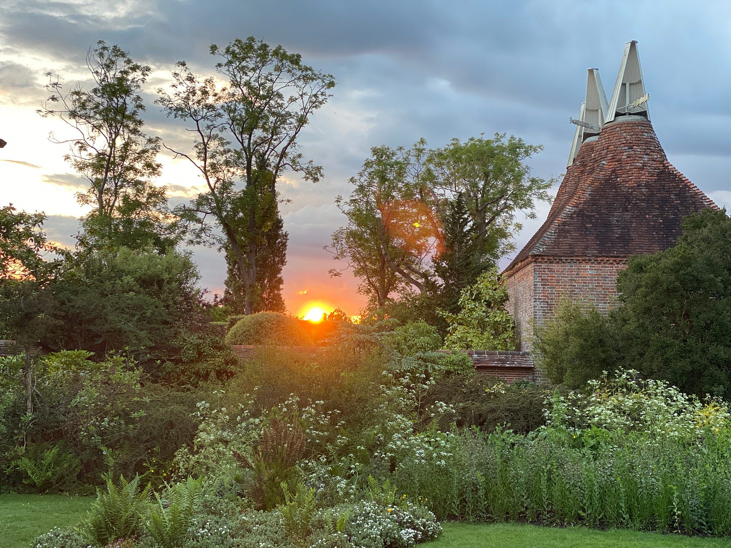 The old oast houses for drying hops at Great Dixter just at sunset. Photo by Marianne Willburn