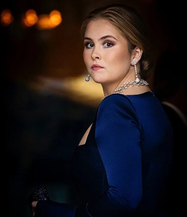 Princess Amalia wore a royal blue Rowan twist front satin crepe gown by Alex Perry, Queen Maxima wore a light blue gown by Valentino