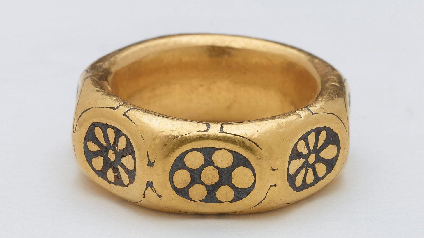 Undated handout photo issued by the British Museum of a gold ring with a black-coloured pattern on it from the ninth century that was part of a £3 million Viking hoard.