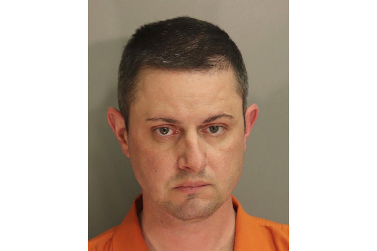 This photo provided by the Montgomery County Detention Center in April 2021, shows Christopher Bauer. On Friday, June 14, 2024, the former FBI agent was convicted of sexually assaulting an 11-year-old girl while serving as an Alabama state trooper — a law enforcement job he landed even after he was kicked out of the FBI amid earlier claims that he raped a co-worker at knifepoint. (Montgomery County Detention Center via AP)