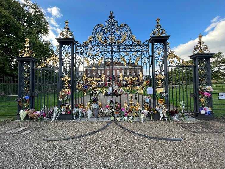 Flowers left outside of Kensington Palace for the recently deceased Queen.