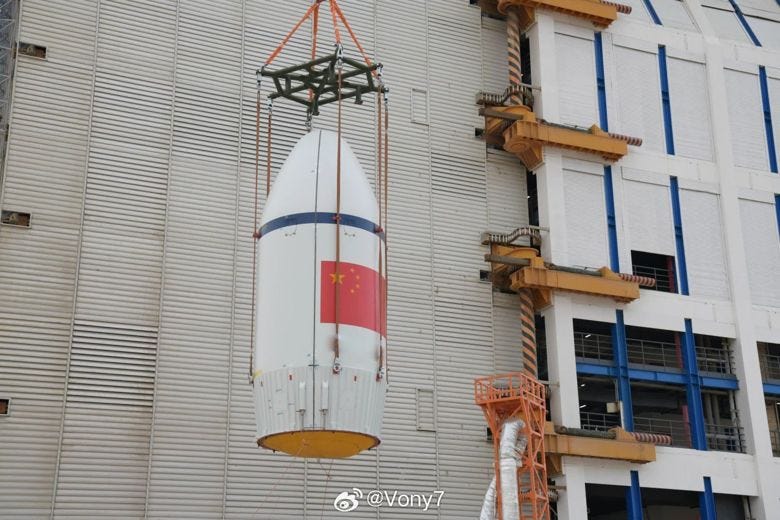 The Long March 6C's fairing being lifted onto the rocket at Launch Complex 9A.