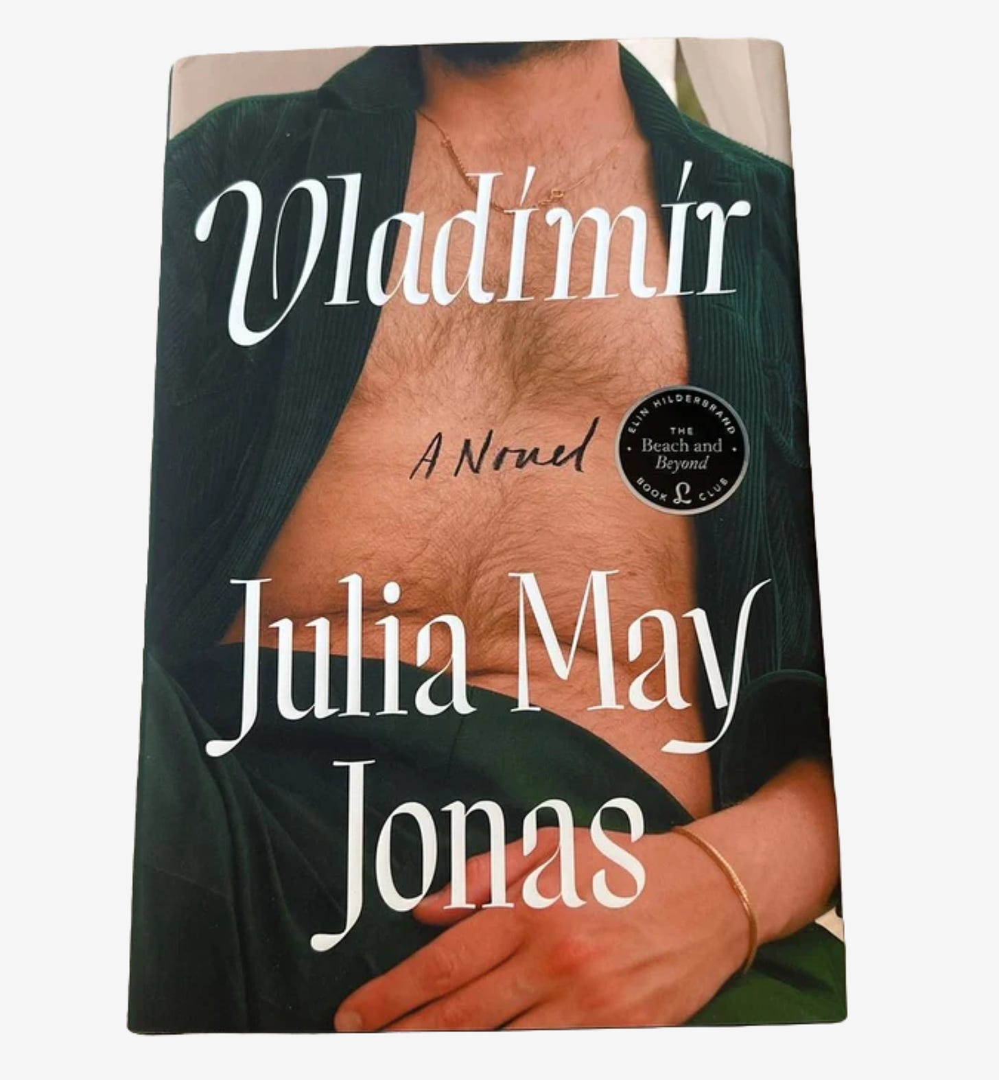 Avid Reader Press hardcover edition of Vladimir by Julia May Jonas (zoomed-in torso of a white man wearing a forest green velvet suit with a thin gold bracelet and no shirt underneath)