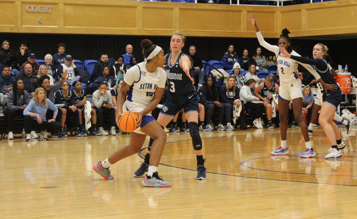 Seton Hall’s Azana Baines prepares to pass while being guarded by Villanova’s Lucy Olsen on Jan. 3, 2024. (Photo by Adam Zielonka)