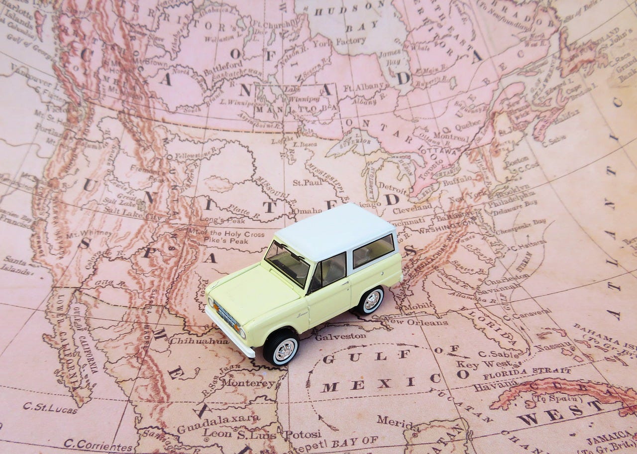 Map of North America, with a toy jeep in Mexico