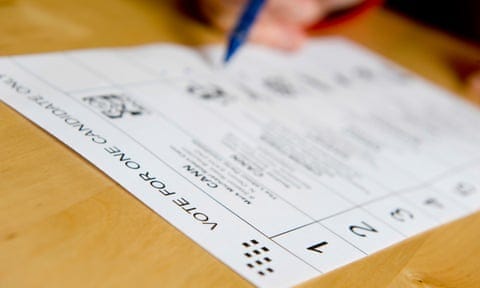 Person filling in a voting form