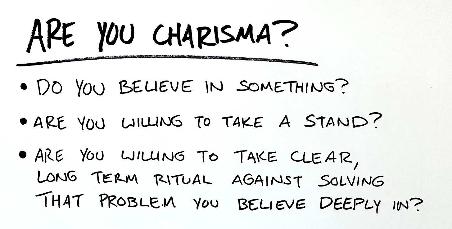 a hand written list with the title are you charisma? The list is 3 bullet points: do you believe in something? are you willing to take a stand? are you willing to take clear, long term ritual against solving that problem you believe deeply in?