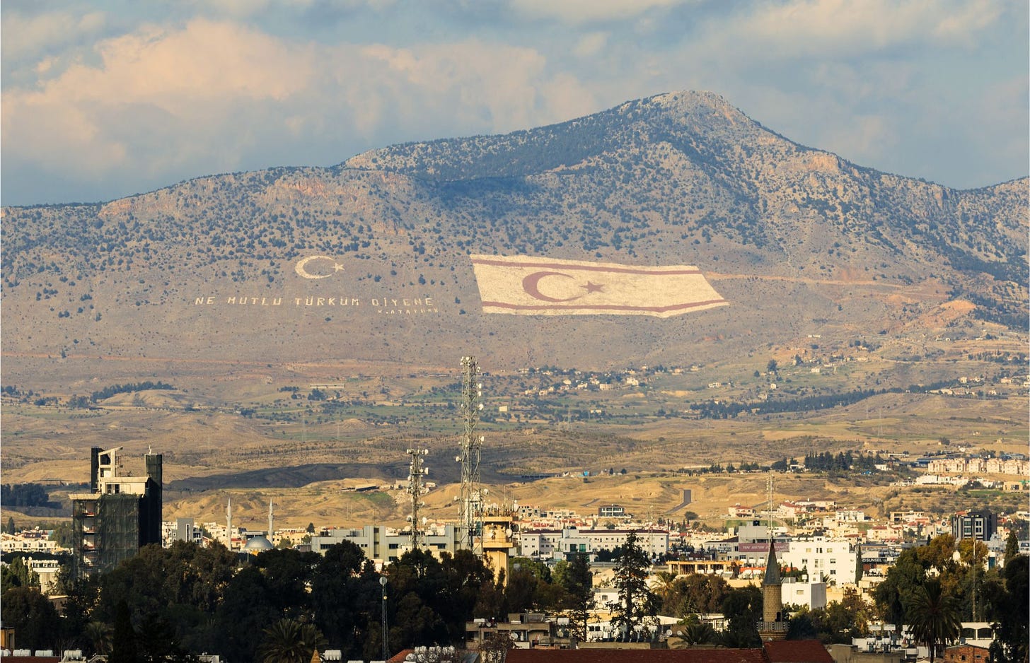 Turkish and TRNC flag on mountains overlooking Nicosia