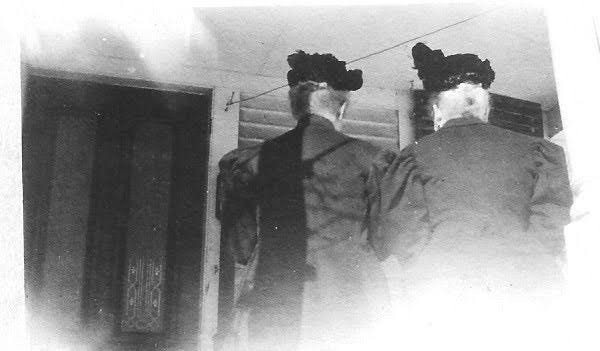 Two women (back of heads)