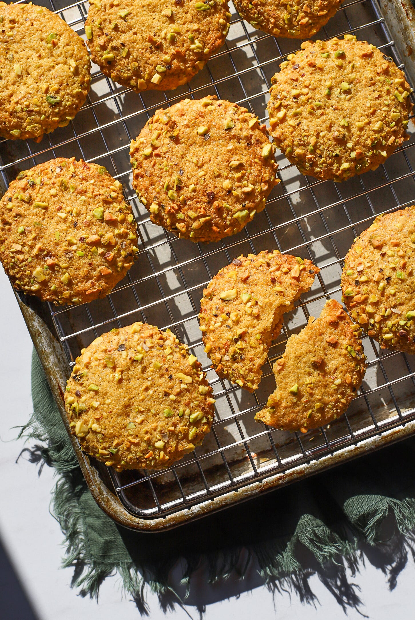 Tray of saffron and pistachio cookies on a rack