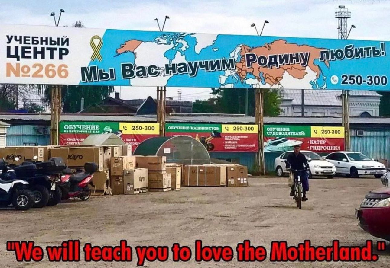 “We will teach you to love the Motherland” - sign at Russian market shows a Russia owning half of Europe, Central Asia, and Alaska