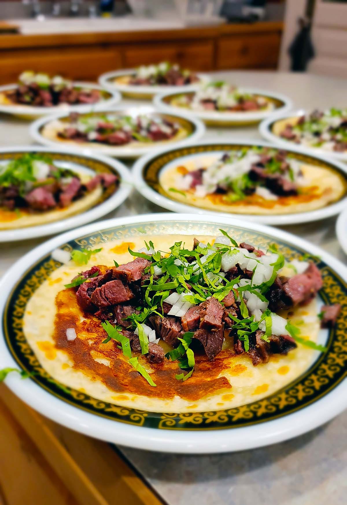 Plates of duck carne asada tacos. 