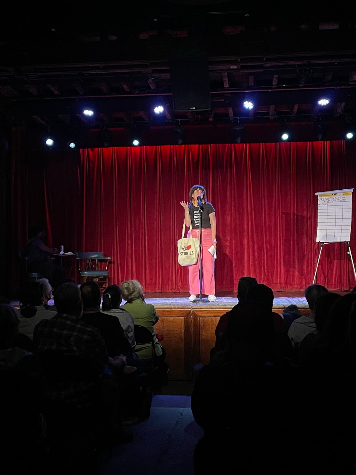 Kate Tellers from The Moth onstage at The BEll House