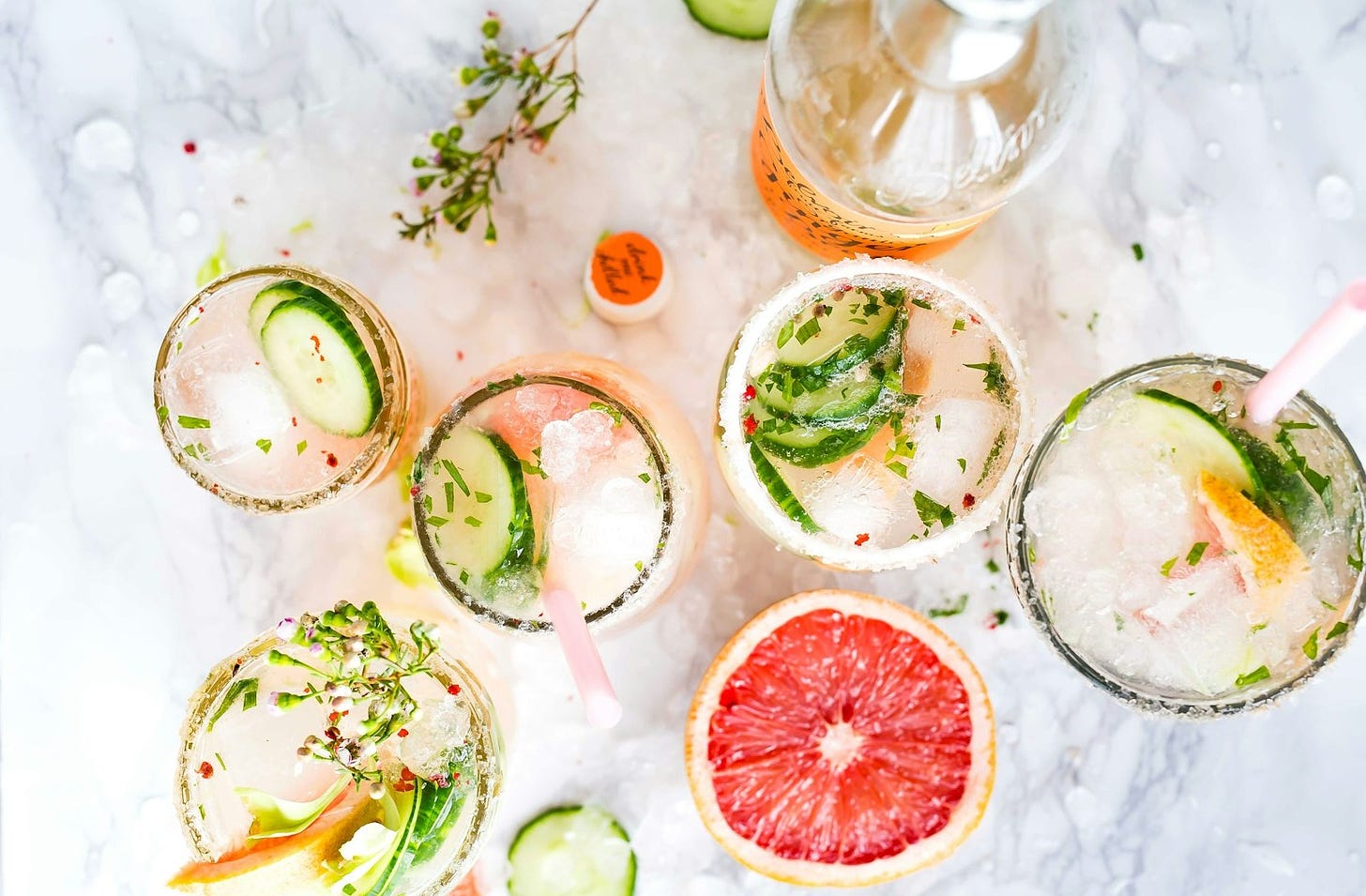 flatlay photography of sliced fruits and cucumbers