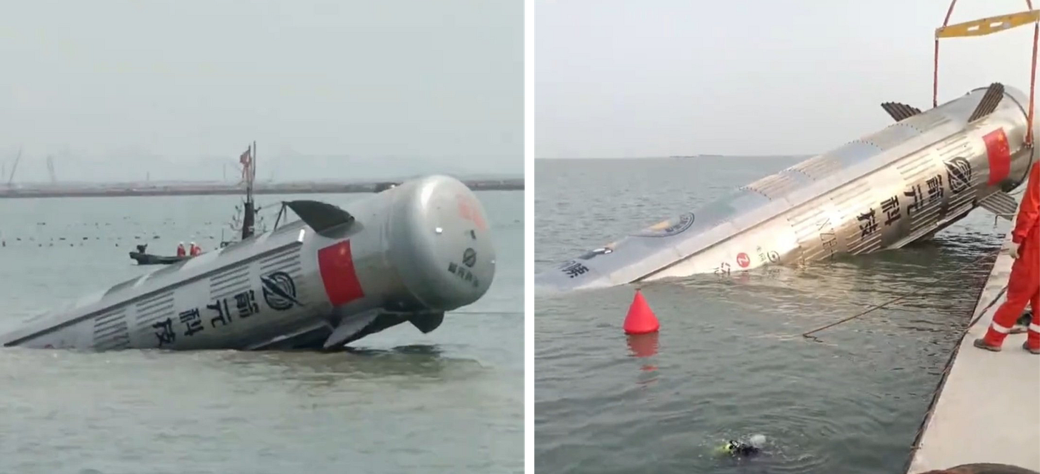 The vertical takeoff vertical landing test vehicle being brought back onto the shore following splashdown.