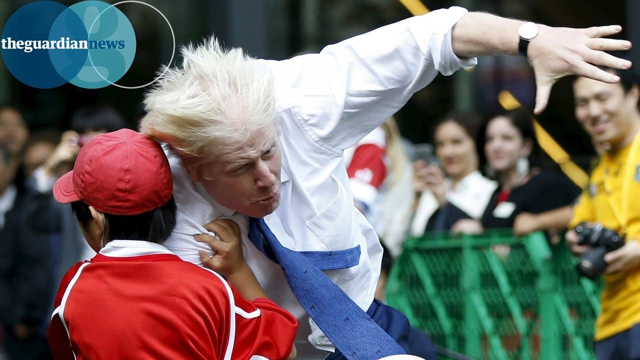 Boris Johnson knocks over boy in rugby match in Japan - YouTube