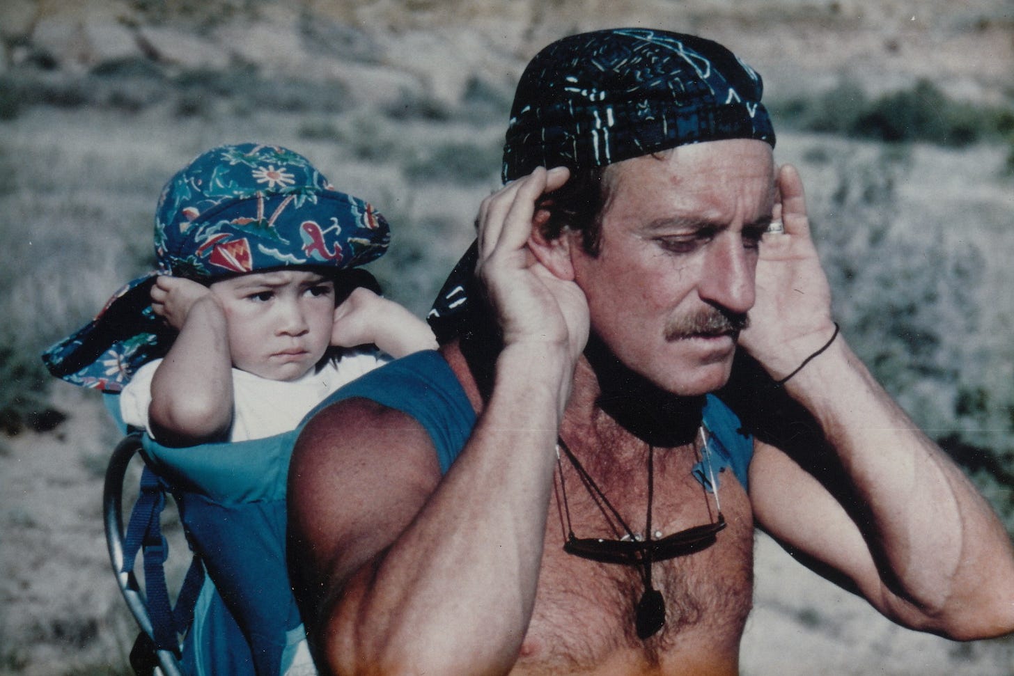 John teaching his eldest daughter, Jade, to track through sound. New Mexico, 1995.