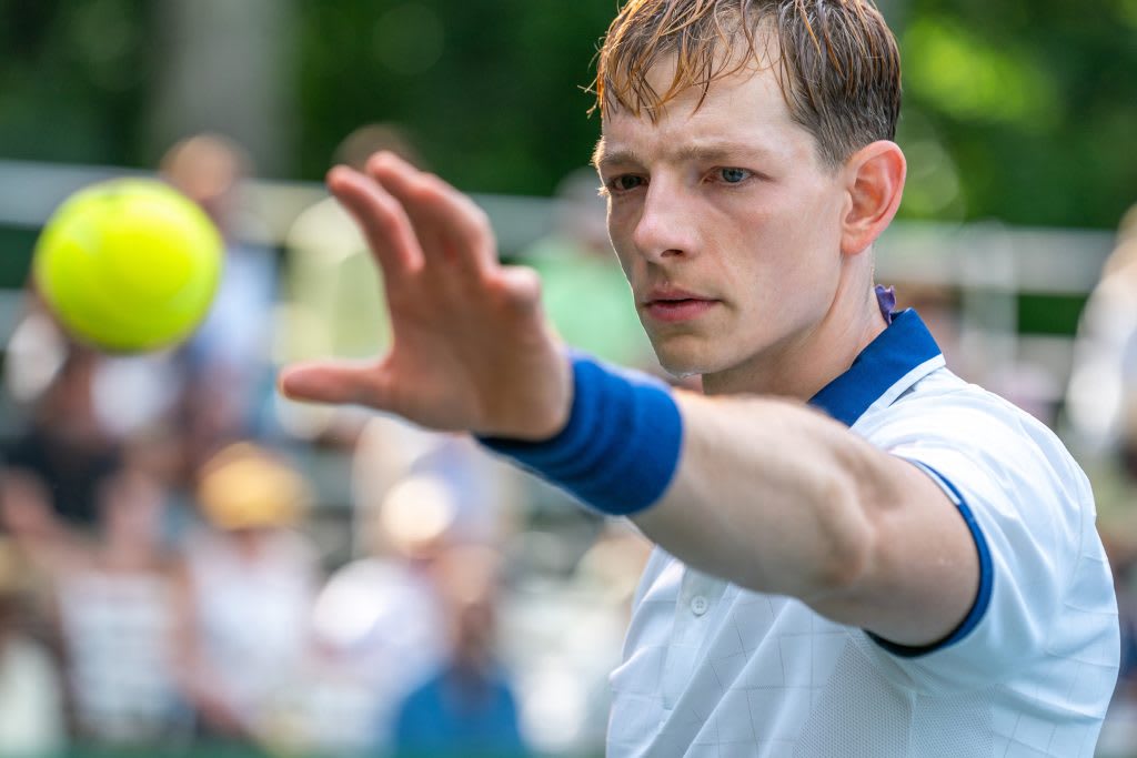 A sweaty Faist reaching for a ball