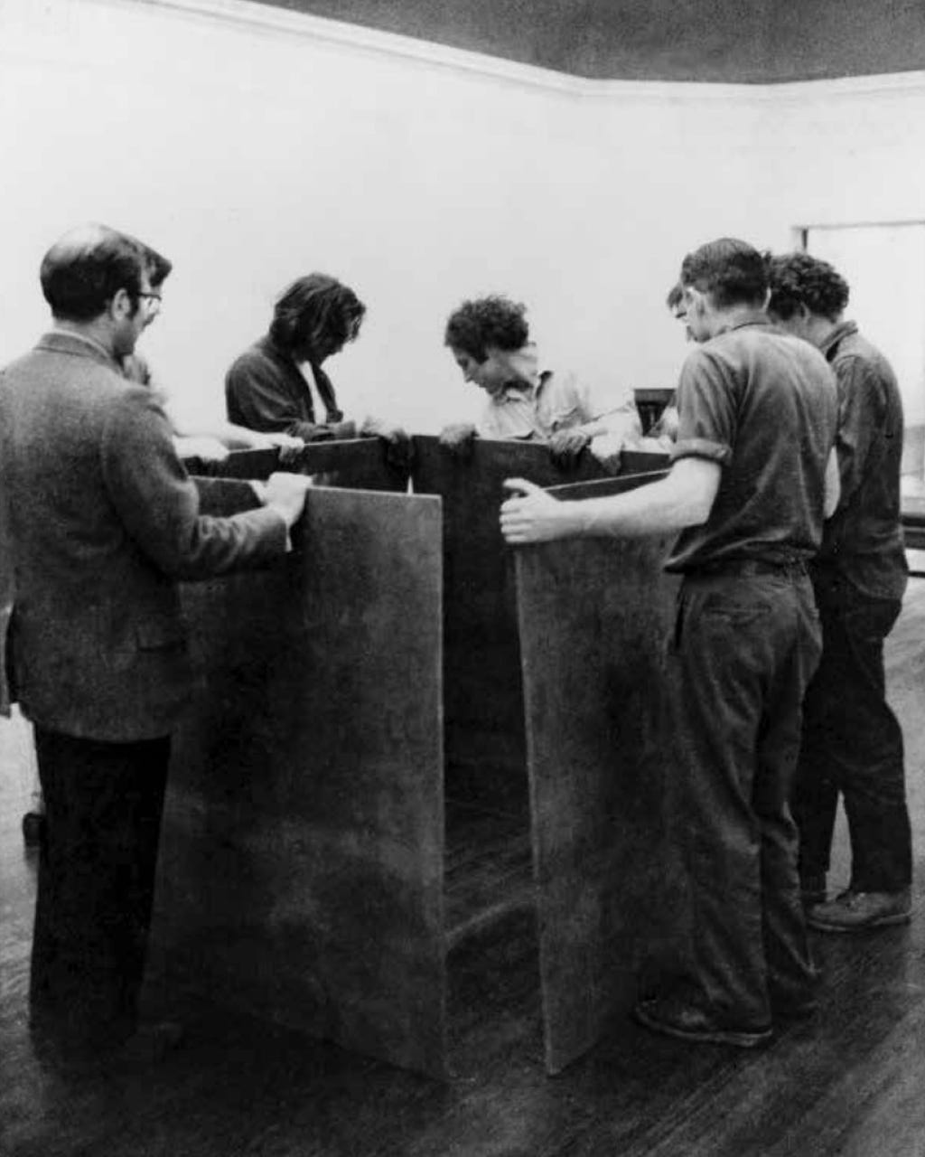 Richard Serra (center) and others installing One Ton Prop (House of Cards), 1969, for the exhibition The George Waterman Collection, Museum of Art, Rhode Island School of Design, Providence, RI, 1969 [David Zwirner Books, New York, NY. Art: © Richard Serra / ARS, New York]