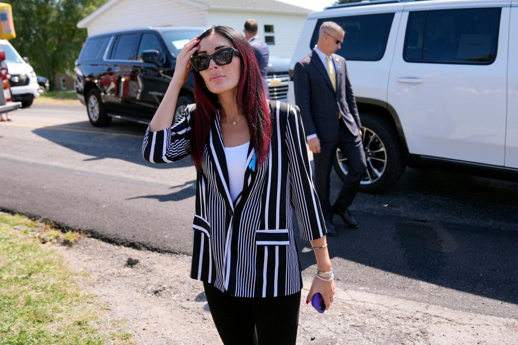 Laura Loomer arrives with Republican presidential nominee former President Donald Trump for a visit to the Shanksville Volunteer Fire Company in Shanksville, Pa., Wednesday, Sept. 11, 2024.