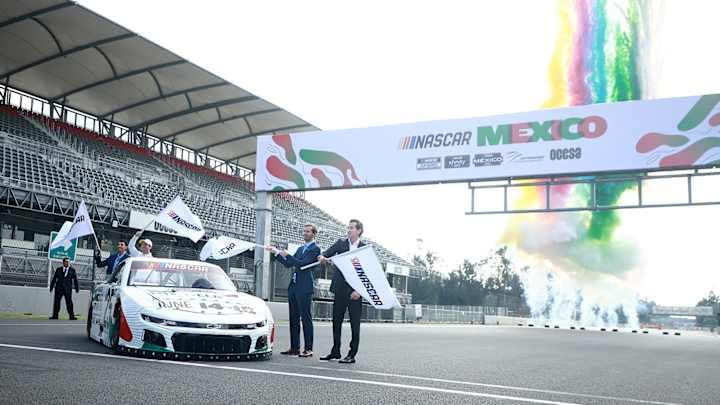 MEXICO CITY, MEXICO - AUGUST 27: Ben Kennedy, NASCAR Executive Vice President & Chief Venue & Racing Innovation Officer, joins NASCAR Cup Series driver Daniel Suarez to announce that the NASCAR Cup Series will race in Mexico City for the first time next year at Autodromo Hermanos Rodriguez on August 27, 2024 in Mexico City, Mexico.