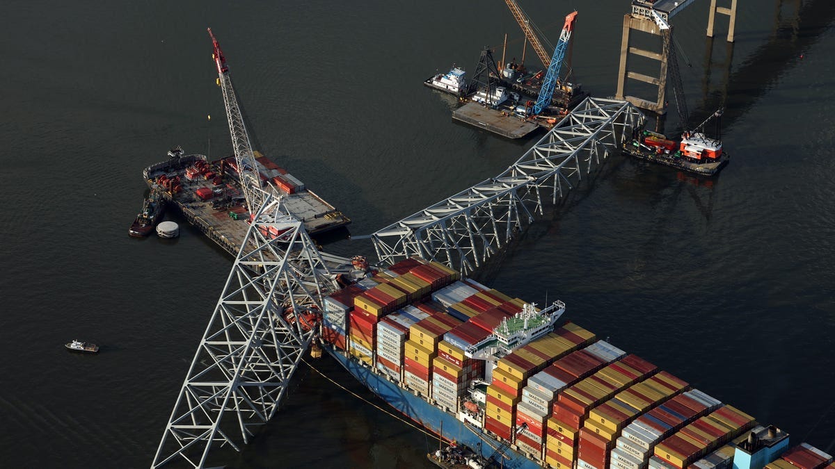 In an aerial view, salvage crews continue to remove wreckage from the cargo ship Dali after it stuck and collapsed the Francis Scott Key Bridge in the Baltimore Harbor on April 09, 2024 in Baltimore, Maryland. The Unified Command has started removing containers from the Dali while also working to clear the channel to restore the flow of commerce to the Port of Baltimore. The bridge collapsed after being struck by the 984-foot cargo ship Dali at 1:30 AM on March
 26.