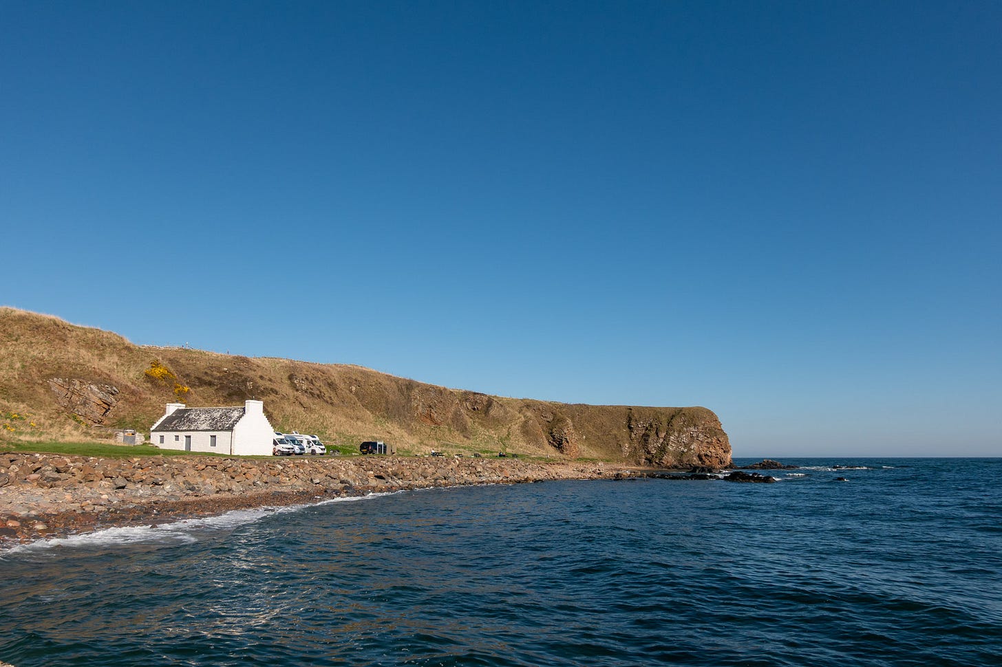 Motorhomes parked by the Salmon Bothy at Dunbeath Harbour © Felicity Martin