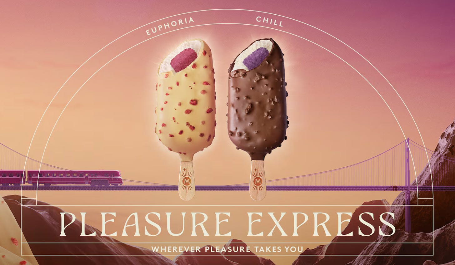 The Pleasure Express advertisement. It's a sunset background with a purple train traveling across a suspension bridge, and in front are the two chocolate bars. This time they're fully covered, with a bite taken out of each revealing the colorful center. But it's too late, you know? We've already seen what's in there.