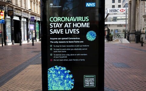 HM Government, and NHS advertising boards advice to stay at home and help save lives in Birmingham city