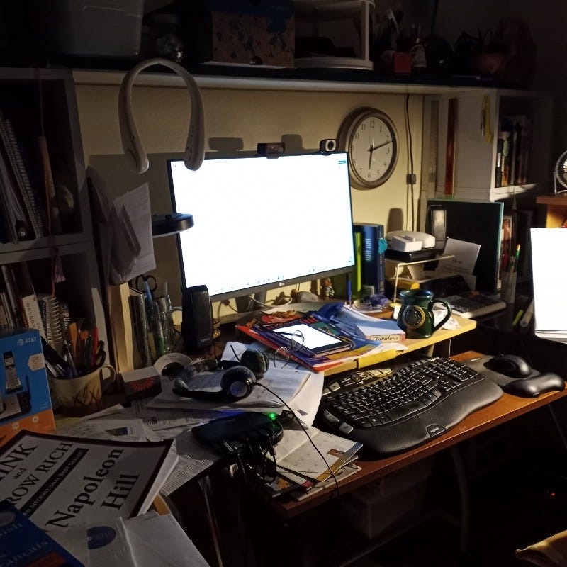 My desk, the one that is so messy every time the cat goes by something is knocked off.