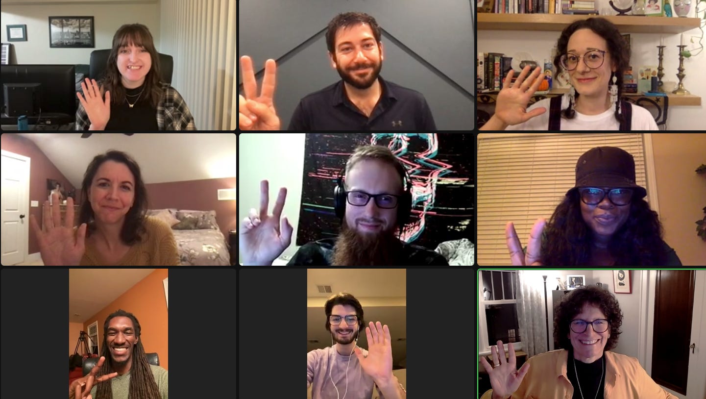 Nine filmmakers on a Zoom call, all smiling and waving or giving peace signs.