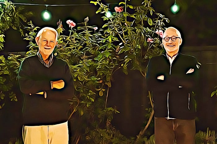 Two men standing in front of a tree

Description automatically generated with low confidence