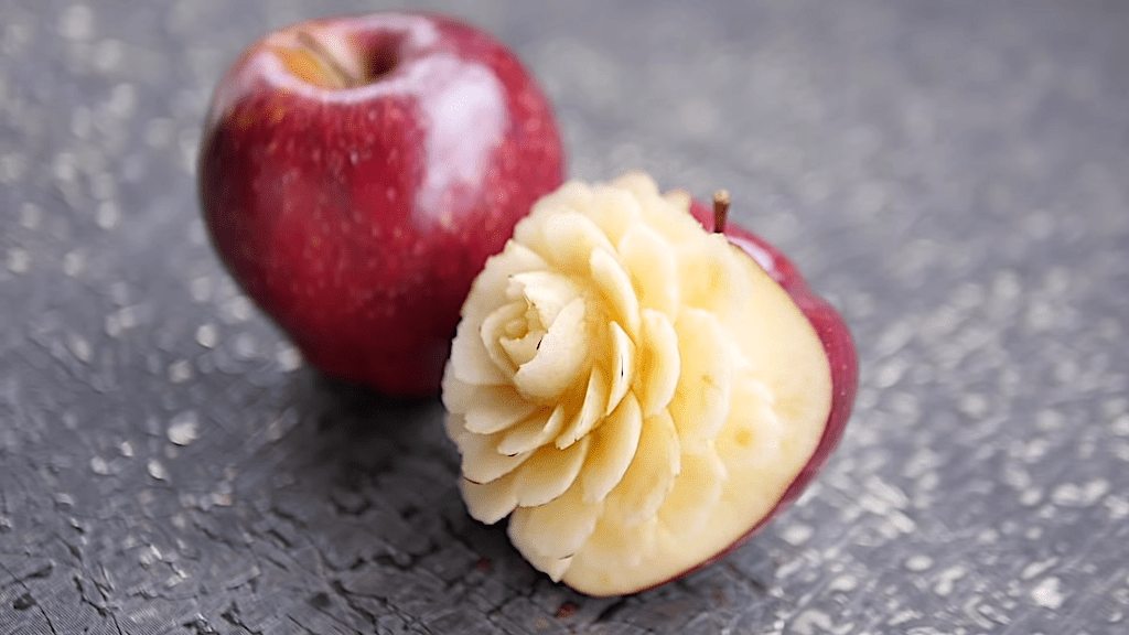 Apple carved into the shape of a rose