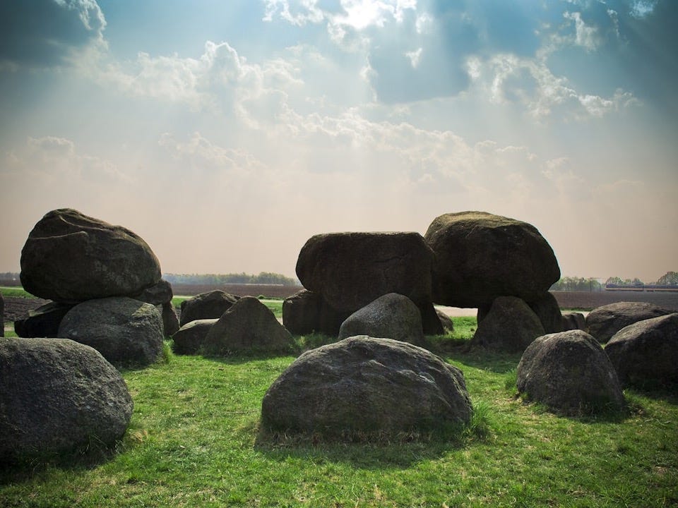 stone formation at the green grass field