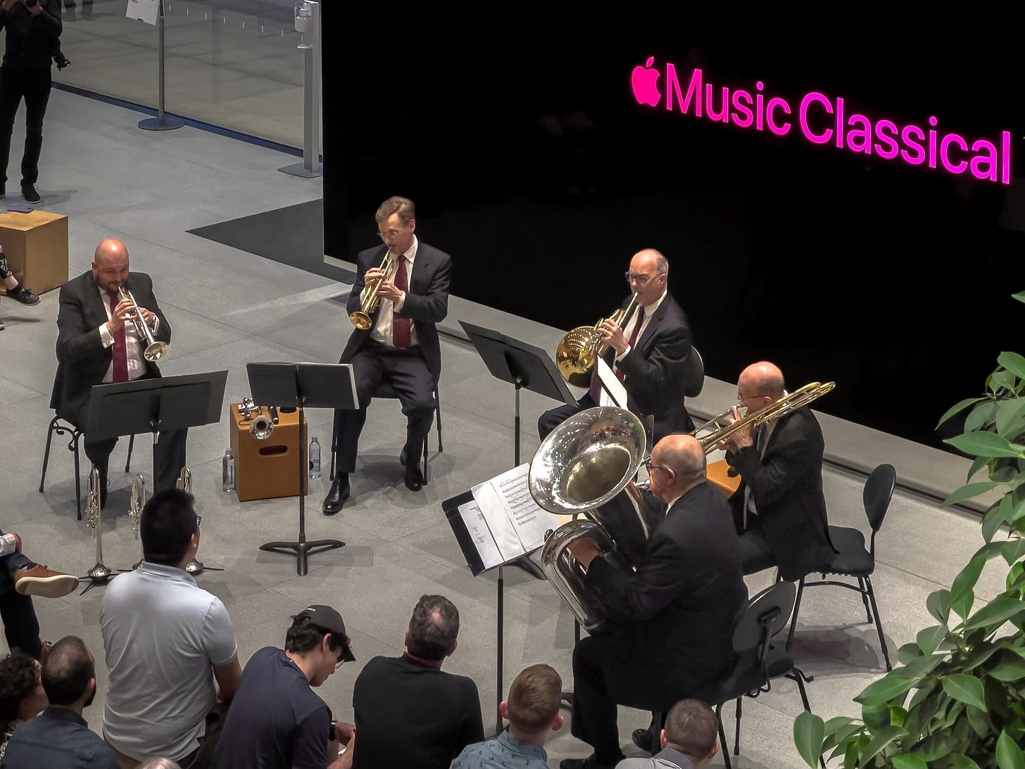 The Chicago Symphony Orchestra Brass Quintet performs in the Forum at Apple Michigan Avenue.