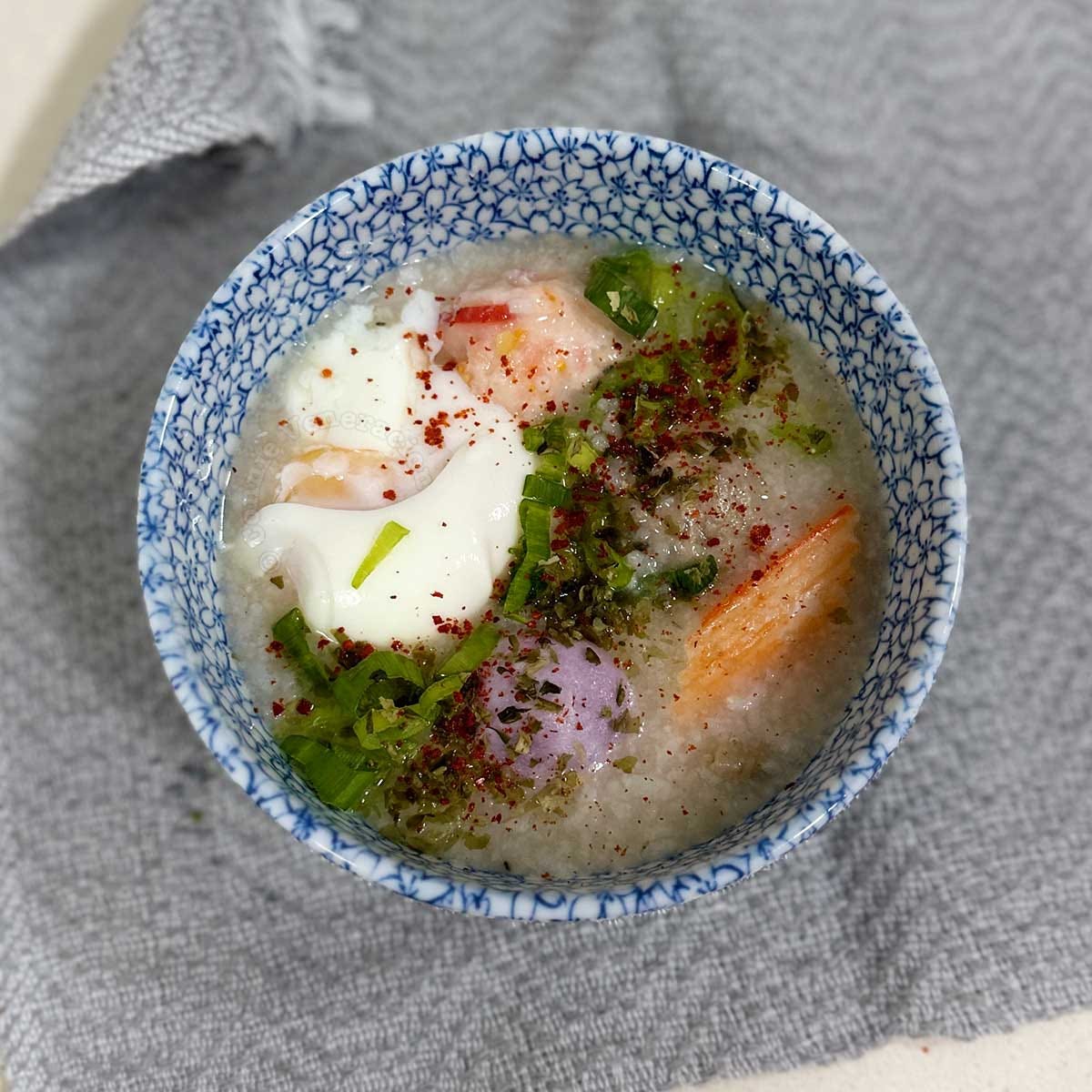 Congee with seafood balls and egg