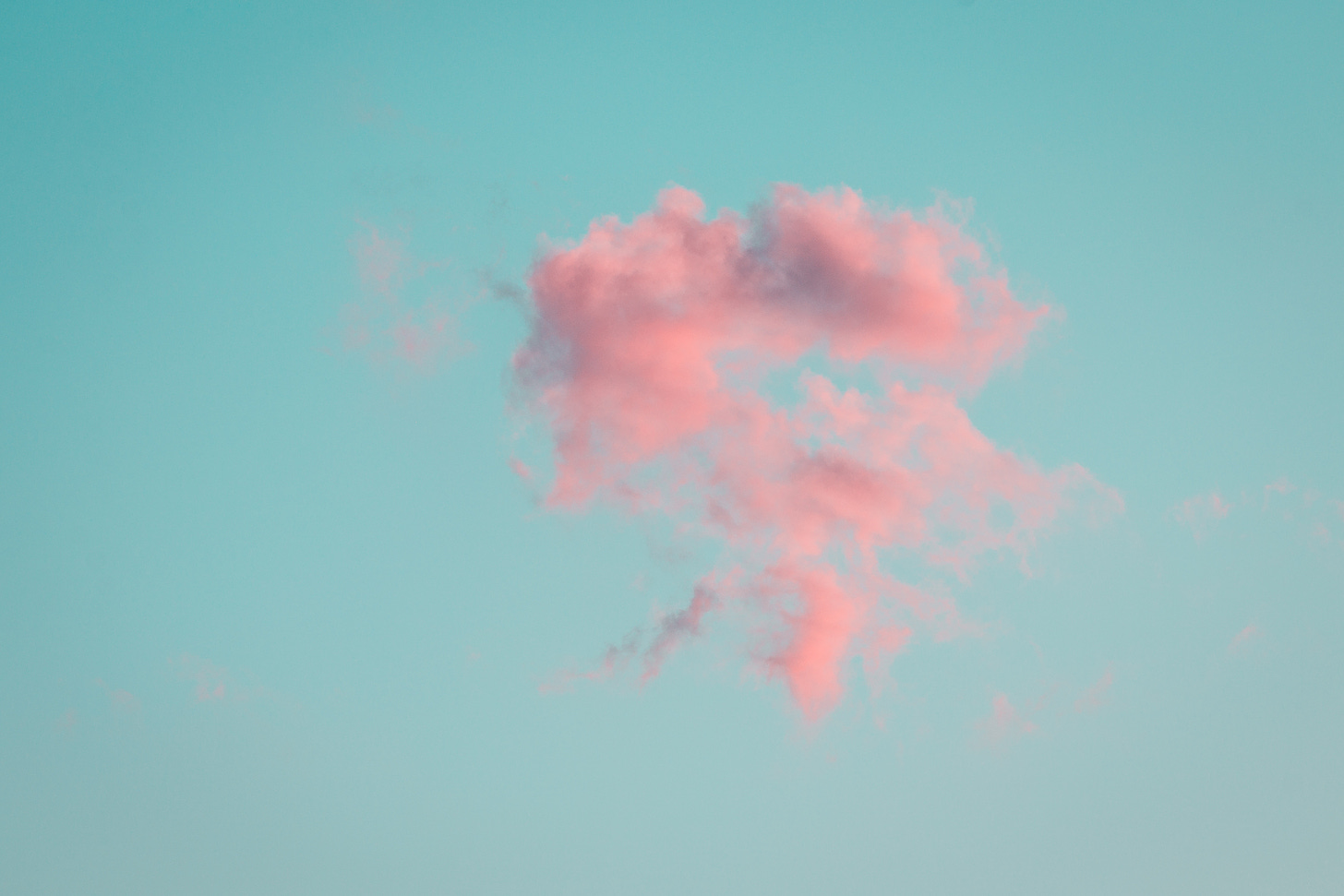 pink clouds against a blue sky