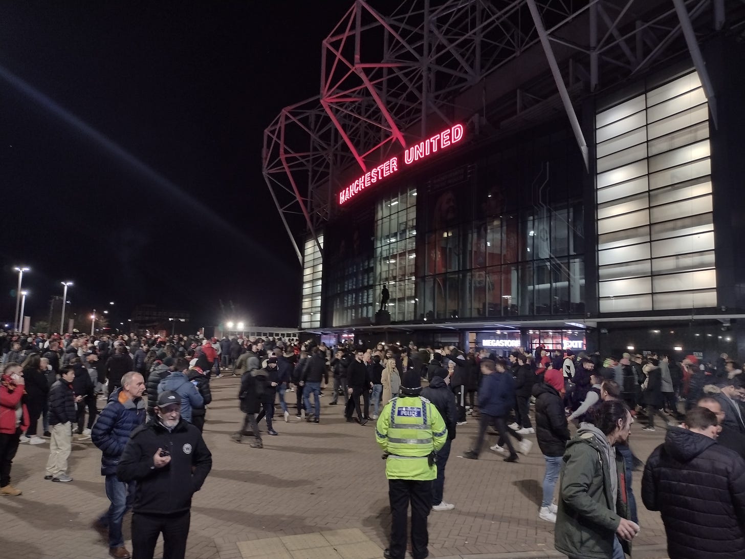 crowd walking around outside of Old Trafford