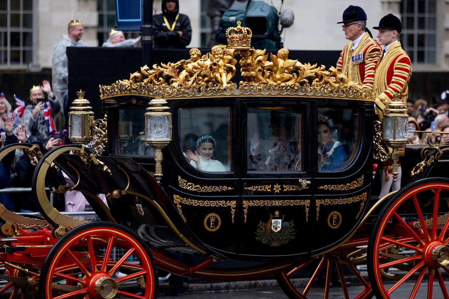 Princess Charlotte waving from carriage at King Charles's coronation