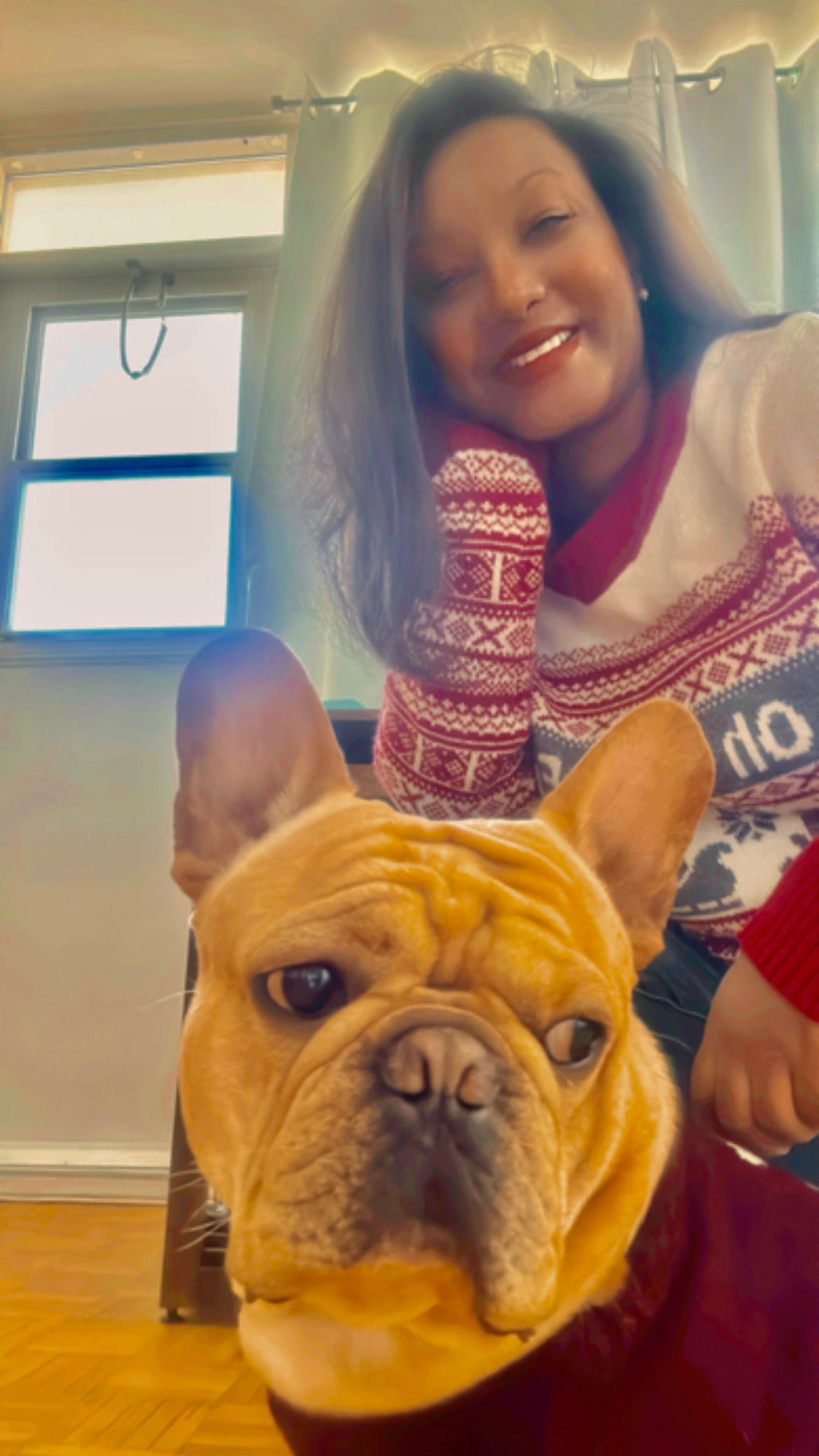 Woman in red sweater with a dog