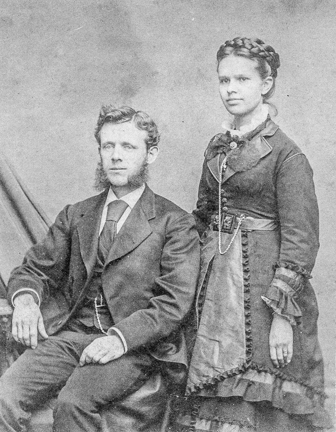 Seated man and standing woman
