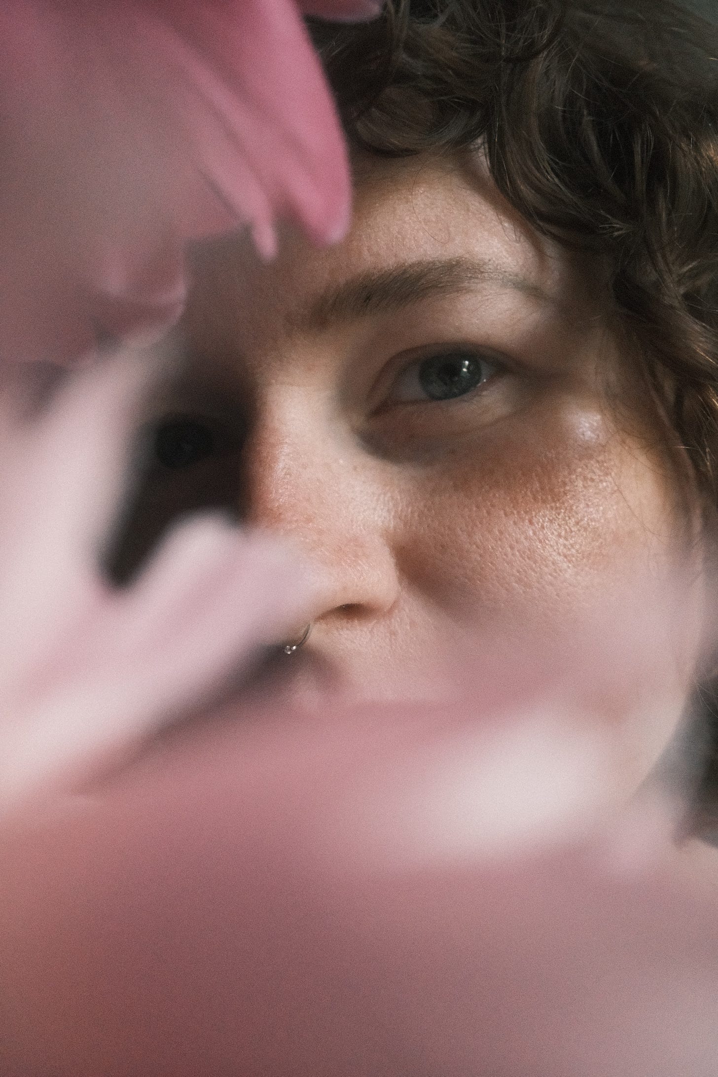 Me, gazing at the camera, surrounded by peonies