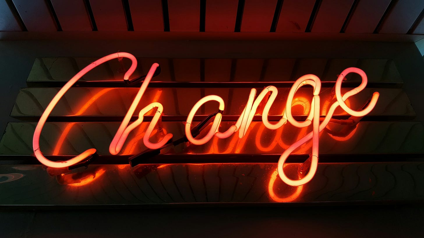 A neon sign that says 'Change'.